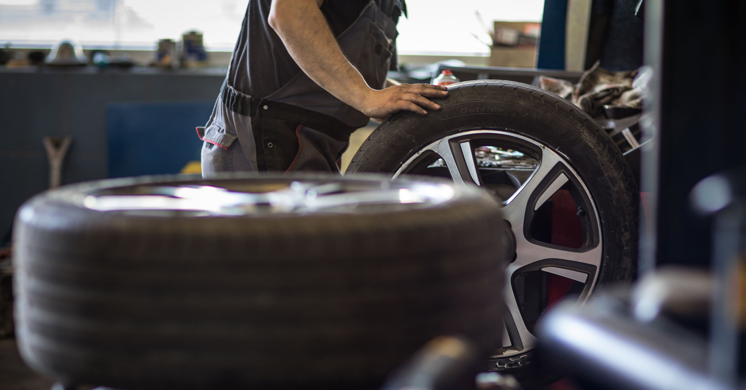 Tasker performing a Wheel & Tire Service job.